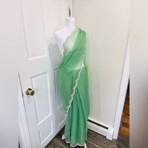 Elegant Green Saree with Silver Trim
